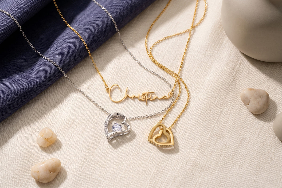 Gold and silver necklaces arranged together on linen