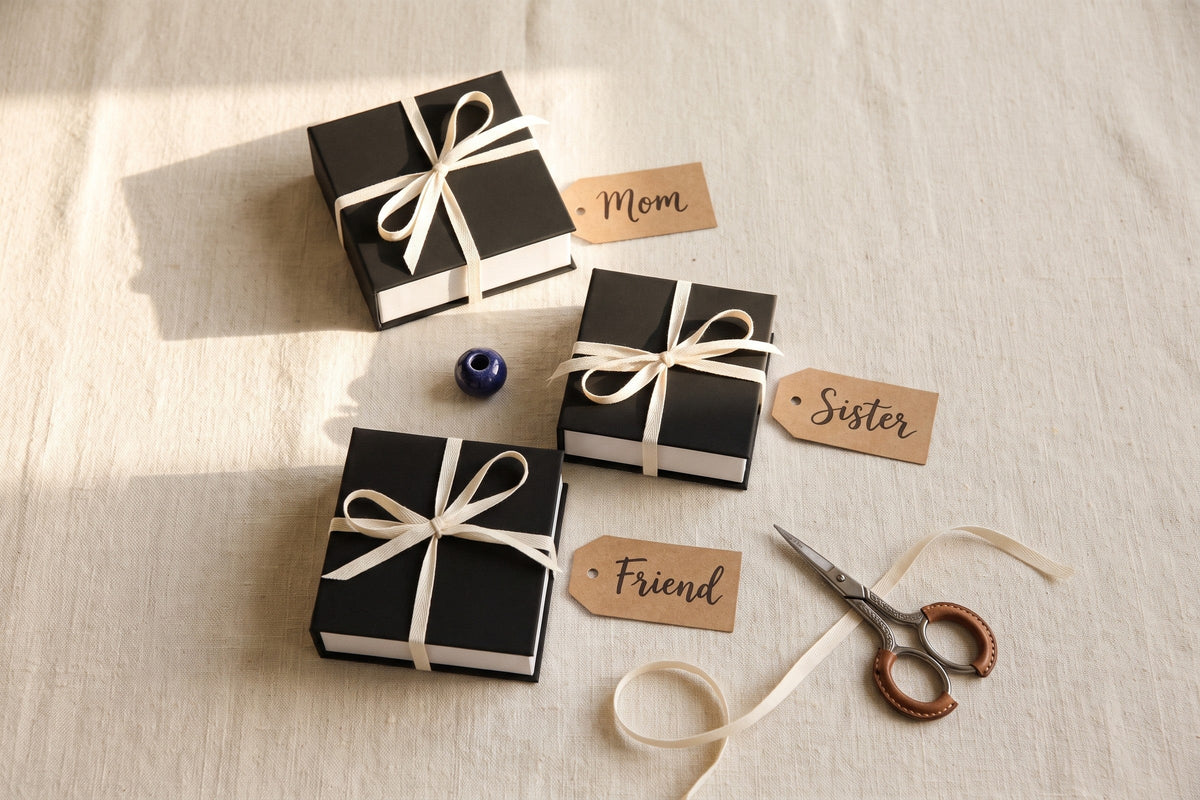 Three gift boxes tagged Mom, Sister and Friend