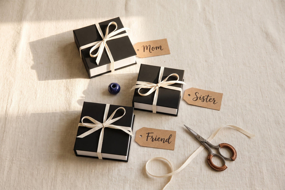 Three gift boxes tagged Mom, Sister and Friend