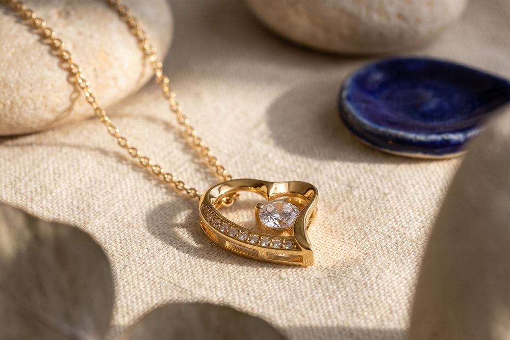 Close-up of a gold-finish open heart pendant