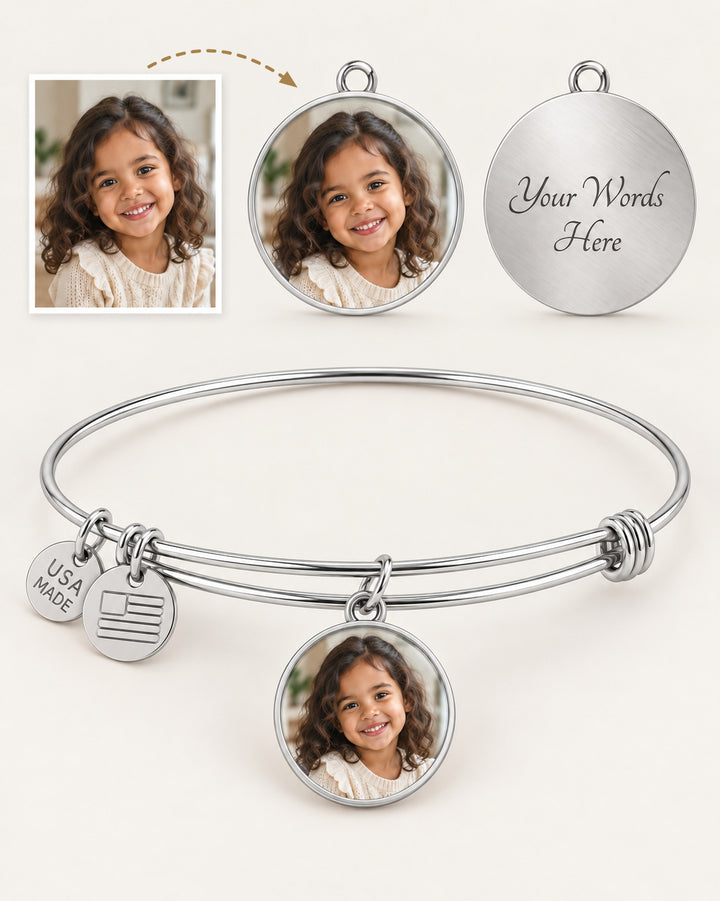 Silver-tone circle photo bangle with example photo and reverse engraving views.