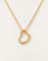 Delicate open-heart necklace in a gold finish on an ivory background.