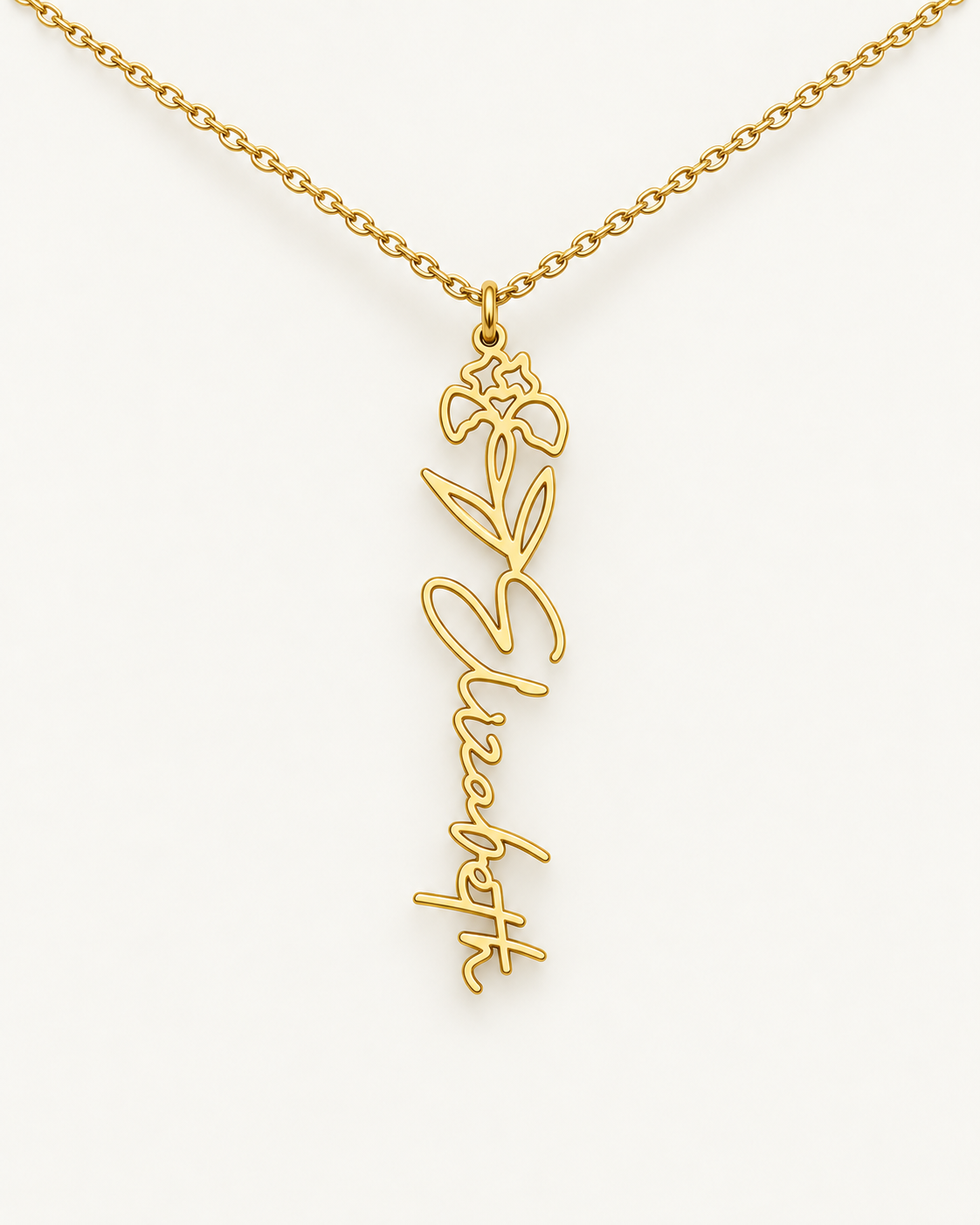 Gold-tone birth flower necklace with a daffodil motif and vertical script name pendant on ivory.