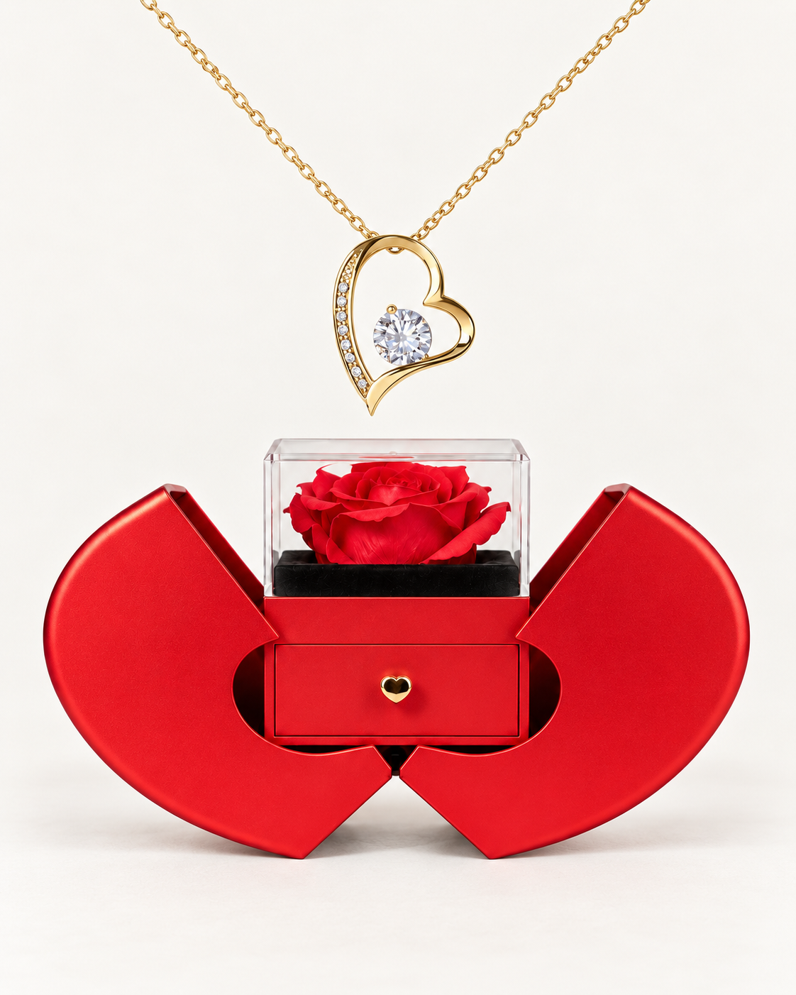 Gold-tone classic heart CZ necklace displayed above an open red heart-shaped rose gift box.