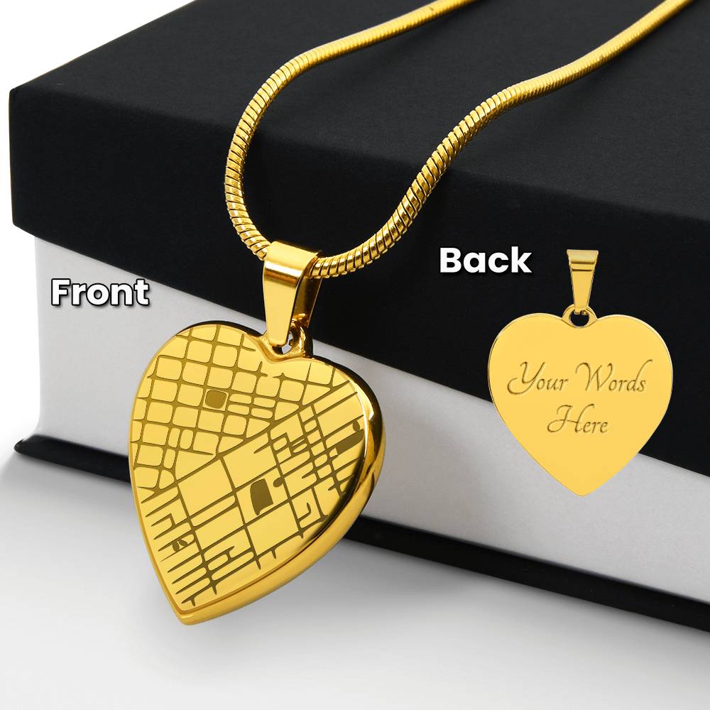 Gold-tone heart map necklace beside a black gift box, with an inset of the engraved reverse.