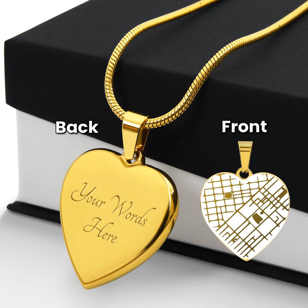 Gold-tone heart pendant reverse engraving beside a black gift box, with an inset of the map front.