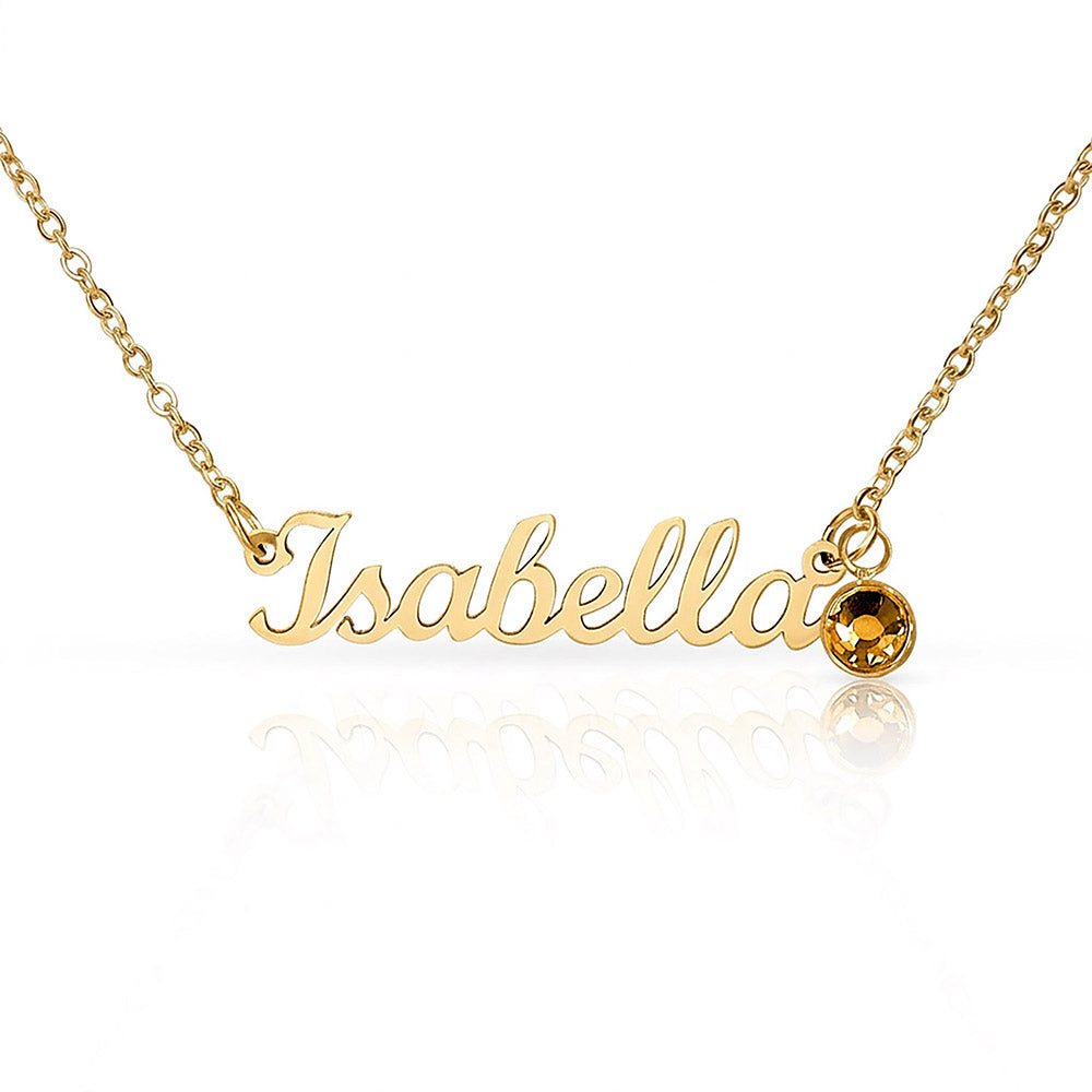 Gold-tone Isabella script name necklace with an amber-colored birthstone accent on white.