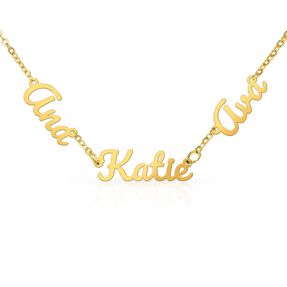 Close-up of a gold-tone necklace with three connected script names.