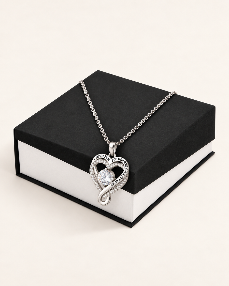 Love You Always silver-tone heart CZ necklace displayed on a black gift box.