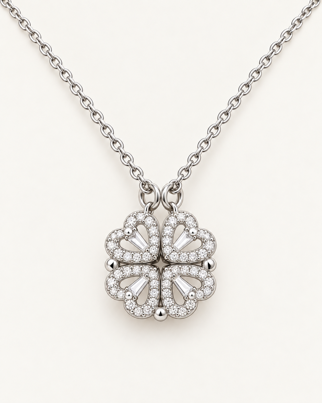 Close-up of the magnetic hearts pendant with four crystal-accented hearts joined into a clover.