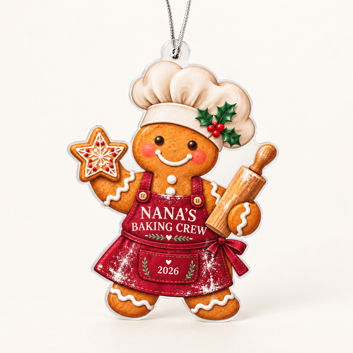 Nana’s Baking Crew 2026 gingerbread baker acrylic ornament on a soft ivory background.