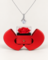Silver-tone ribbon CZ necklace displayed above an open red heart-shaped rose gift box.