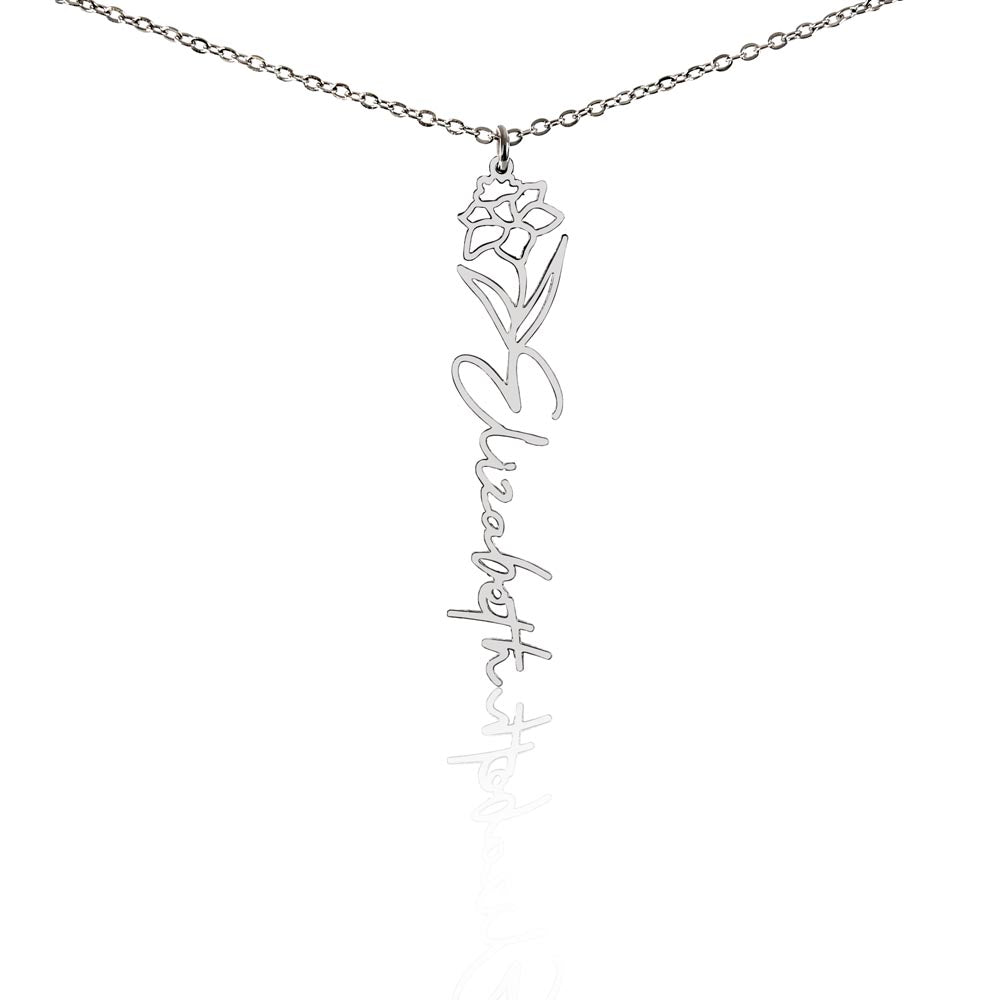 Silver-tone birth flower necklace with a narcissus motif and vertical script name pendant on white.