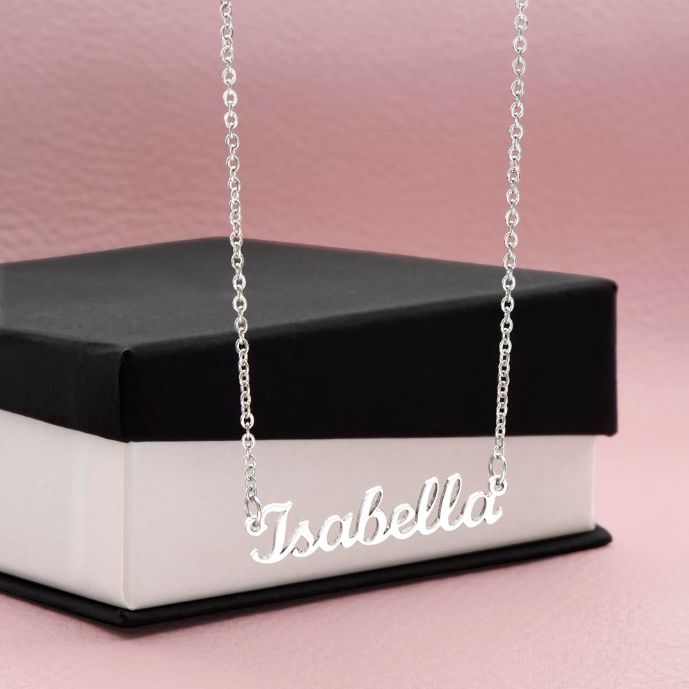 Silver-tone Isabella script name necklace displayed against a black gift box.