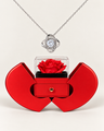 Silver-tone Love Knot CZ necklace displayed above an open red heart-shaped rose gift box.