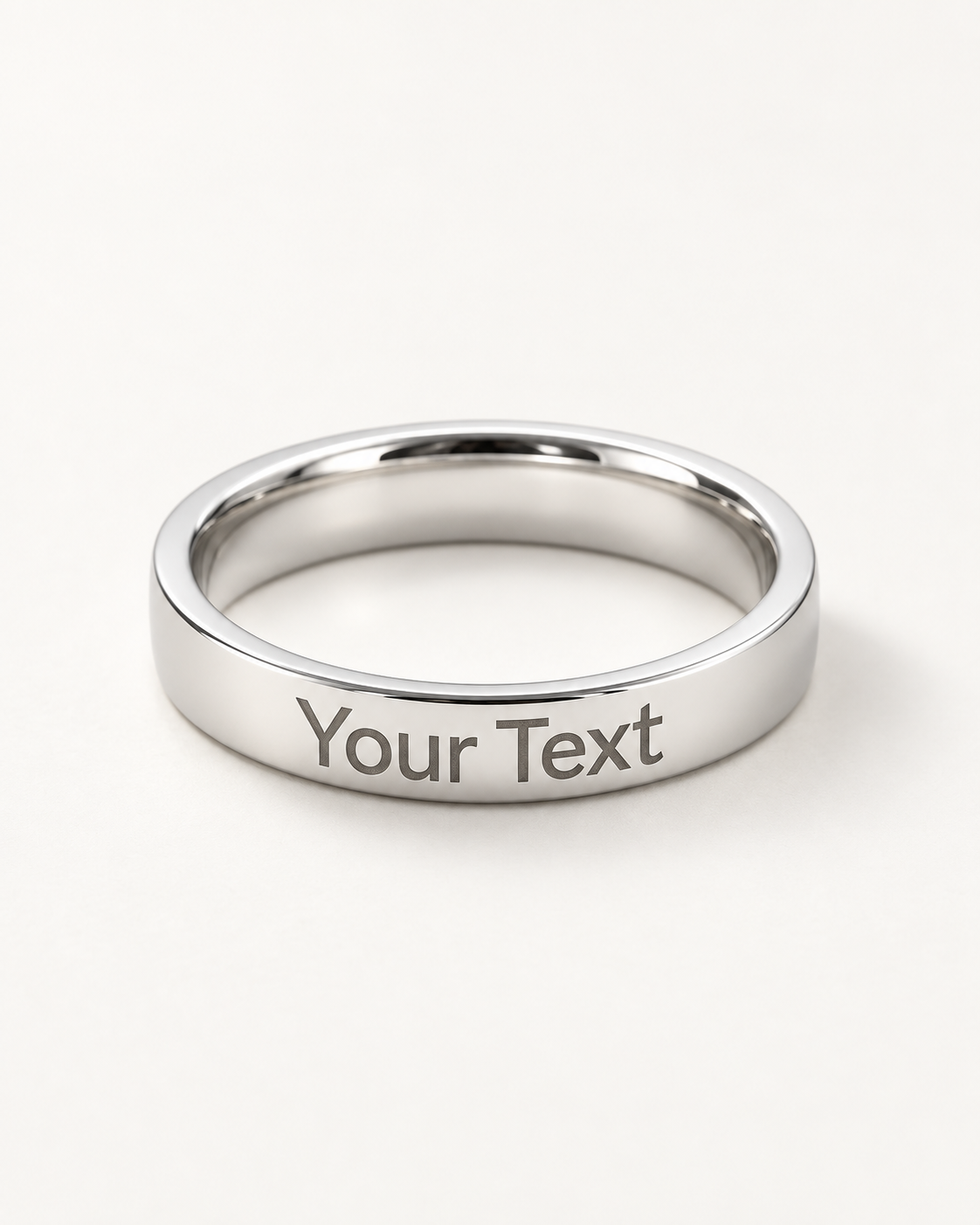 Slim silver-tone engraved ring with a sample Your Text message on the outer band.