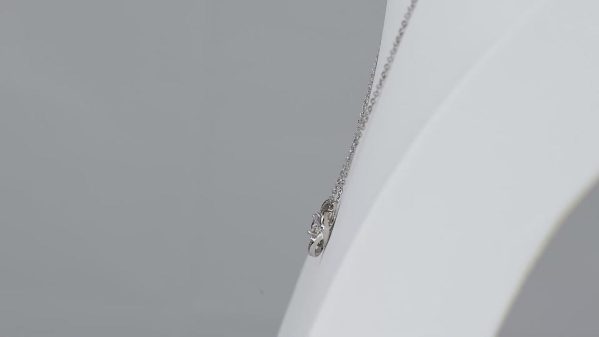 Product video showing the silver-tone Love Knot necklace.
