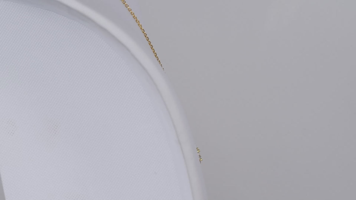 Product video showing the gold-tone Love Knot necklace.